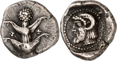 a silver coin with an image of a bird and a bird on it