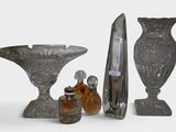 a lot of glass vases that are sitting on a table