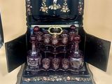 a black box with a set of perfume bottles in it