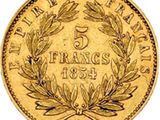 a gold five frans coin with a laurel wreath on it