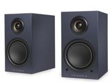 a pair of speakers sitting next to each other on a white surface
