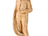 statue of a man in a suit and tie standing with his hands on his hips