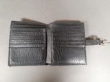 leather wallet with chain attached to it sitting on a table