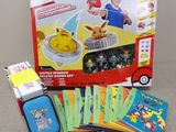a box of pokemon cards and a case of games
