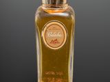 an image of a bottle of perfume sitting on top of a table