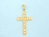 gold cross pendant with pearls on a light blue background