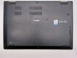 a black laptop with a blue sticker on the back of it