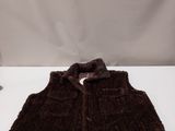 brown fur vest with a bow on the front