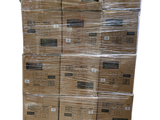 a large stack of boxes that have been wrapped in plastic