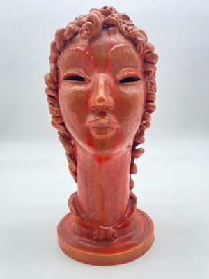 an image of a ceramic head of a woman