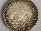a close up of a silver coin with an eagle on it