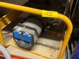 a machine that is sitting in the back of a truck