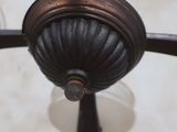 a close up of a ceiling fan in a room