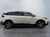 the white suv is parked in a room with a gray floor