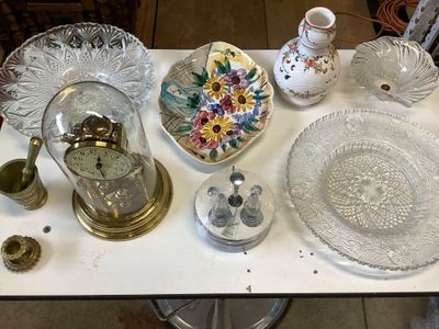 a table that has a lot of glass items on it