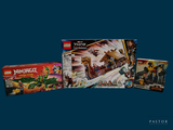 a box of legos sitting on a table next to a box of legos