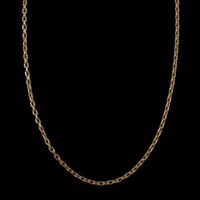 a gold chain necklace with an oval link on a black background
