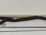 two fishing rods and a fishing rod on a white surface