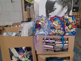 a cardboard box filled with assorted items on a pallet