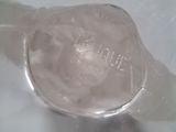 a close up of a glass of water with ice on it