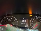 a close up of the dashboard of a car with the lights on