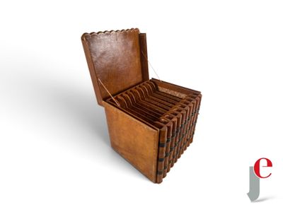 a wooden box that has a bunch of books inside of it