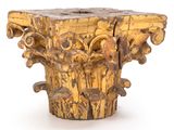 a wooden pedestal with carvings on it on a white surface