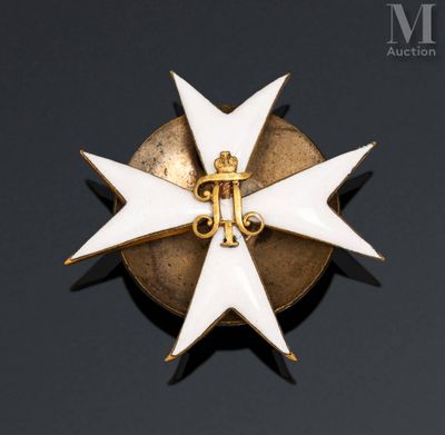 a close up of a gold and white cross on a black background