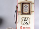 a small gas pump next to a miniature gas pump