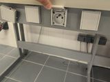 a person that is plugging in to an electrical outlet