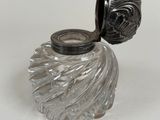 a glass jar with a lid on a white surface