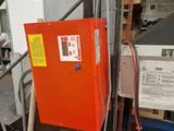 a red box that is sitting in a garage