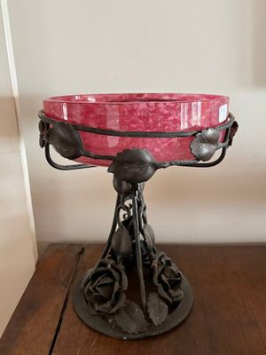 a pink bowl sitting on top of a wooden table