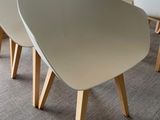 four chairs that are sitting in a row in a room