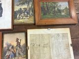 a table with a bunch of framed pictures on it