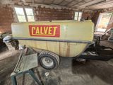 a yellow and red boat sitting in a garage