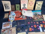 a table with a lot of books and other items on it