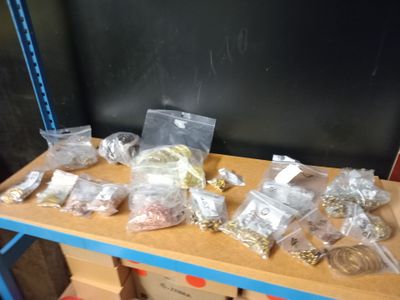 many bags of food on a shelf in a room