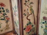 three framed asian paintings of birds and flowers on a wooden floor