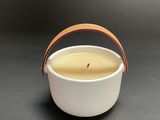 a close up of a cup with a handle on a table