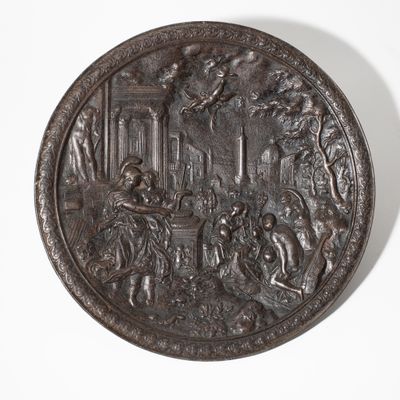 an old bronze plate with a scene of a man and a woman in a garden