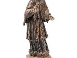 an image of a statue of a woman holding a book