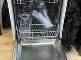 a dishwasher that is open in the kitchen