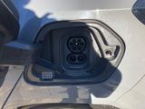 a close up of a car ' s electric plugged in the trunk