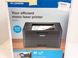 an image of a black and white printer in a box