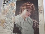 an old book with a picture of a woman in a white dress