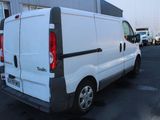 a white van that is parked in a parking lot