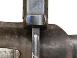 a close up of a metal object with a knife in it