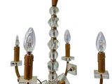 a chandelier with three lights attached to it