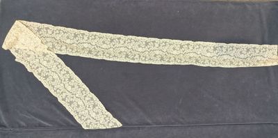 a close up of a piece of clothing on a black surface